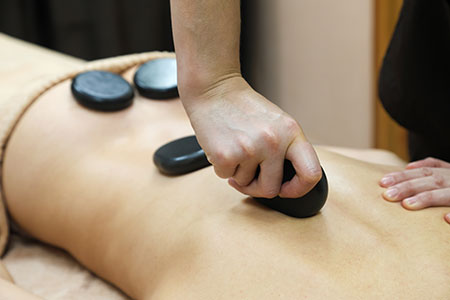 Deep tissue hot stones massage
